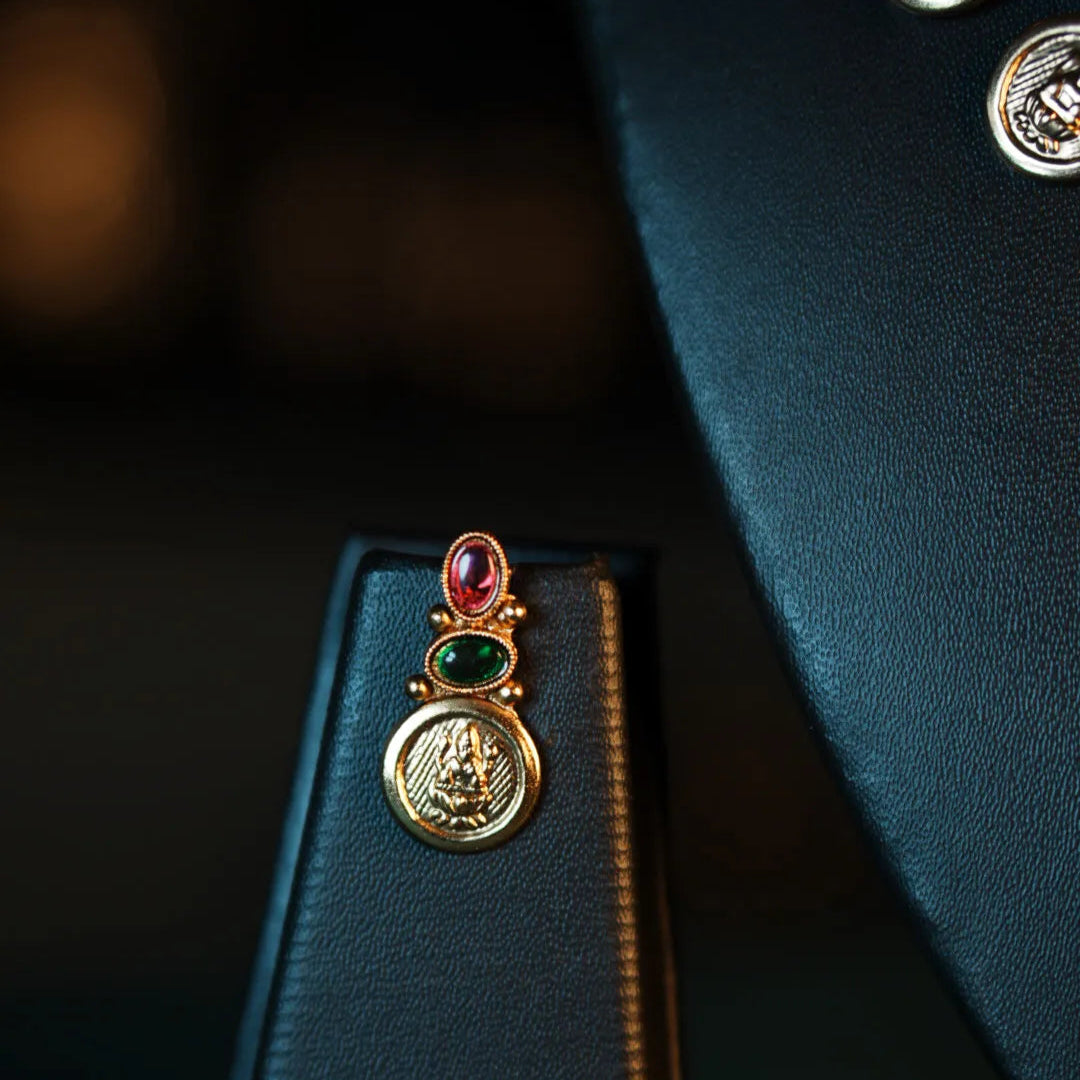 Decorative earring with gemstones on a dark background