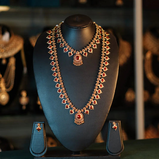 Ornate necklace on a mannequin bust with a blurred jewelry store background
