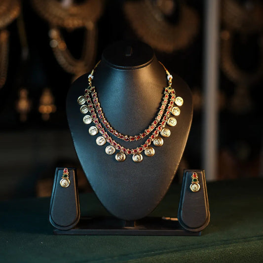 Jewelry set on a black mannequin bust with a blurred background